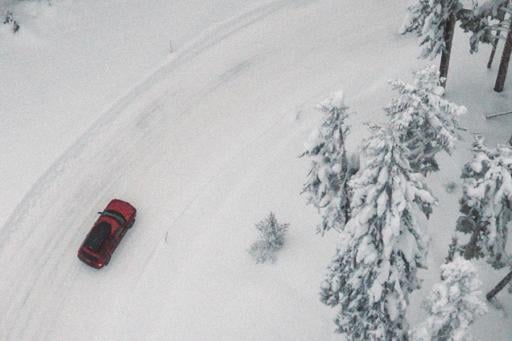 Tips for Safe Winter Driving - car on a snow-covered forest road